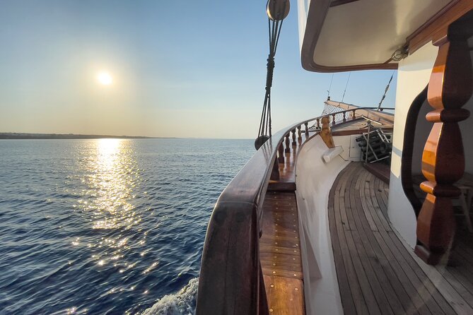 Aerosa Sunset Afternoon Guided Cruise with Dinner in Cyprus - Dinner at Fig Tree Bay, with the coast lit up after sunset