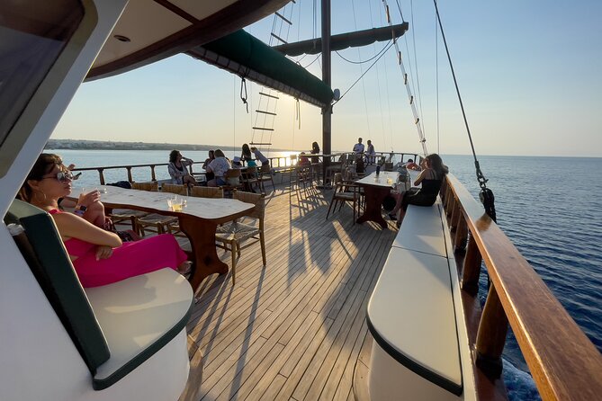 Aerosa Sunset Afternoon Guided Cruise with Dinner in Cyprus - The return route: chapel, sea caves, and Protaras after dark