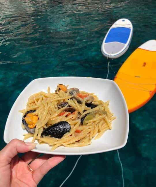 Alghero: Scenic Catamaran Cruise with Lunch and Snorkeling - A relaxed afternoon on the catamaran