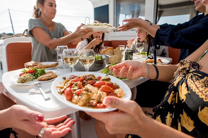 Athens Semi Private Sunset Catamaran Cruise with meal & drinks - A generous seafood dinner served on board