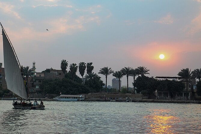 Cairo/Giza: Nile Sunset, Dinner Cruise, Show & Private Transfer - Sunset and city lights from the upper deck