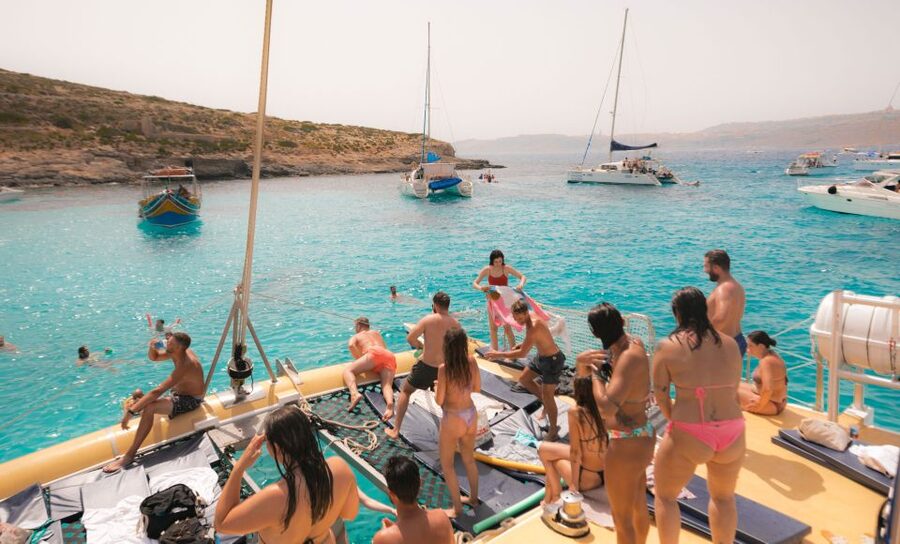 Comino: Blue Lagoon Catamaran Cruise with Lunch and Open Bar - From relaxed sailing to music and dancing