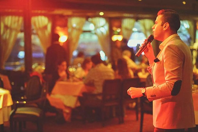 Dinner Cruise on the Nile River with Buffet, Cultural Show and Private Transfer in Cairo - Cairo at night, seen from the Nile