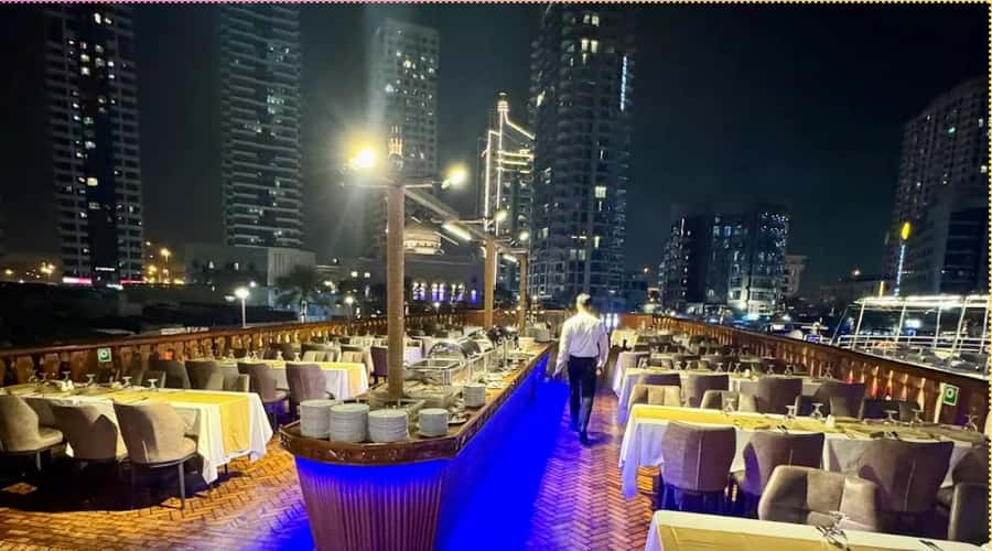 Dubai: Marina Dhow Dinner Cruise with Live Entertainment - Dinner, drinks, and the value of $62