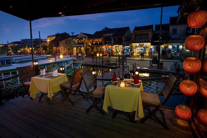Experience Romantic Sunset Dinner Cruise in Hoi An - A private table with seafood for dinner