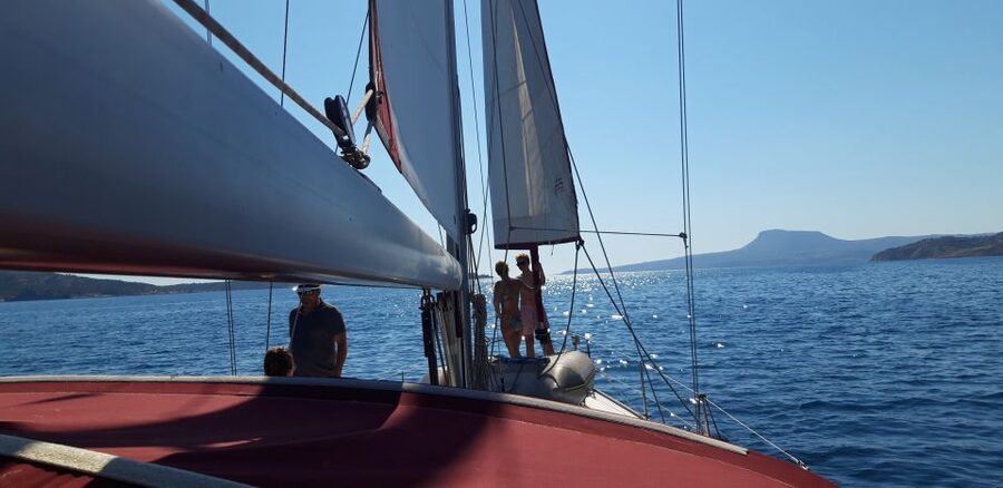 From Chania: Fully Private Sailing Cruise with Meal & Drinks - Having a go at sailing