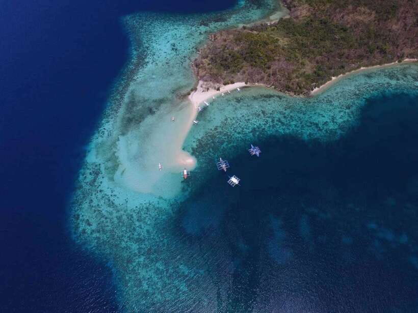 From Coron: Private Island-Hopping Cruise with Lunch - Malcapuya and its shallow southern beach