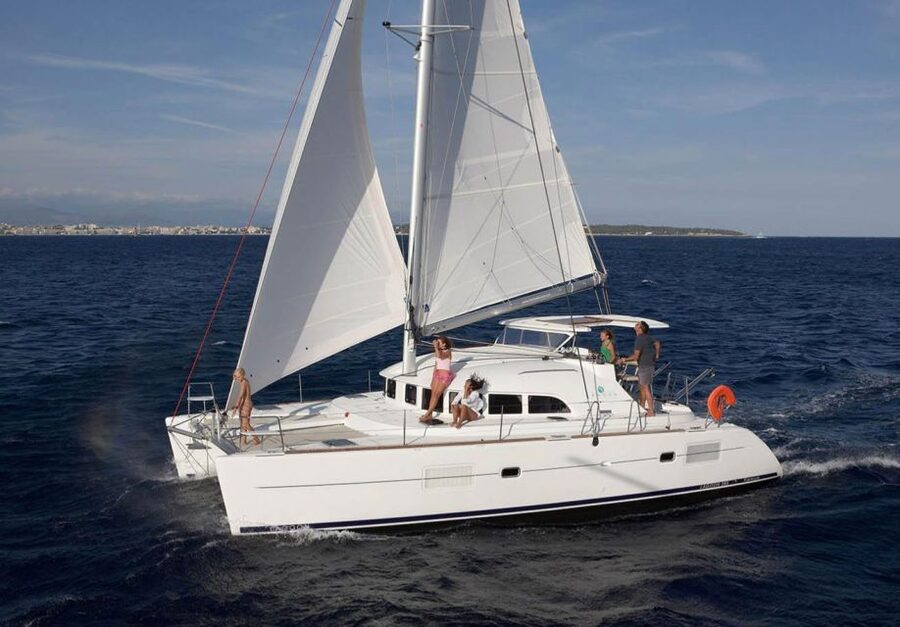From Ornos: Mykonos Delos Catamaran Cruise with Meal & SUP - Lunch cooked aboard the catamaran