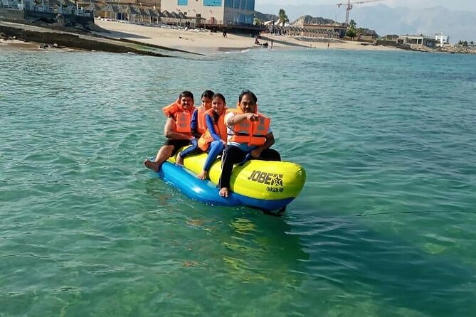 Full Day Musandam Cruise with Lunch and Snorkelling from Dubai - Banana boat, speedboat, and other water fun