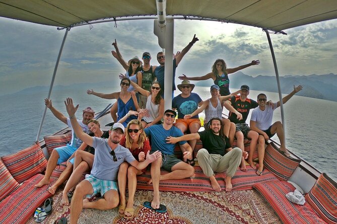 Full Day Musandam Dibba Cruise with Buffet Lunch - Boarding a traditional Omani dhow