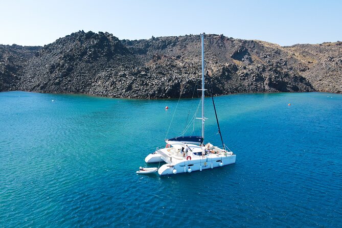 Full Day Santorini Catamaran Private Cruise with meal and transfer - Oia, Fira, and the old port from the sea