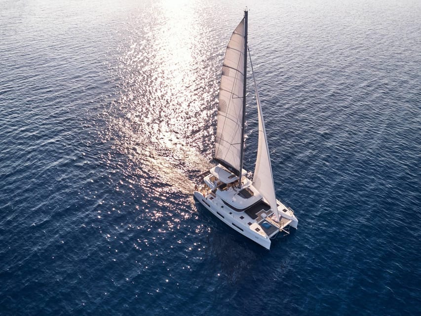 Heraklion: Dia Island Luxury Catamaran Cruise with Meal - Hotel pickup, transfer time, and meeting point