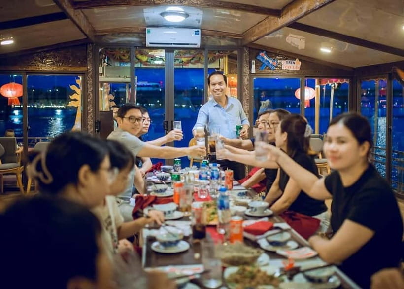 Hue: Perfume River Dinner Cruise with Traditional Show - Costumes, photographs, and flower lanterns