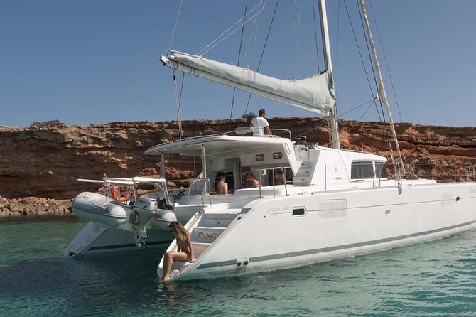 Luxury Catamaran Semi private cruise with meals & drinks and transportation. - Leaving Mykonos by minivan and catamaran
