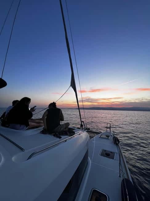 Majorca: Dinner aboard a private catamaran with snorkeling and paddle surfing - Returning to Palma after dark