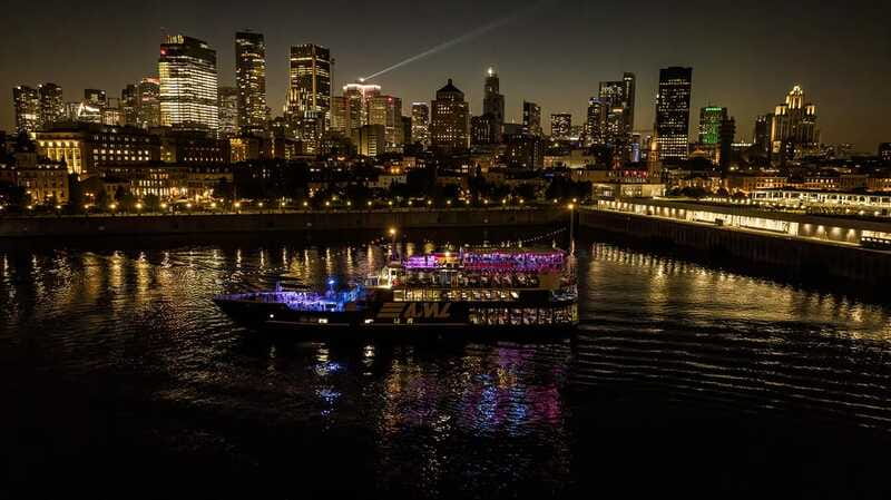 Montreal: Evening Cruise with DJ and Dance Floor - The Jacques Cartier Bridge after sunset