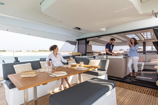 Mykonos: Brand-New Catamaran Cruise with Meal, Drinks & Transport - Lunch, wine, beer, and the social mood
