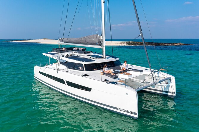 Mykonos: Brand-New Catamaran Cruise with Meal, Drinks & Transport - What you see when Delos appears