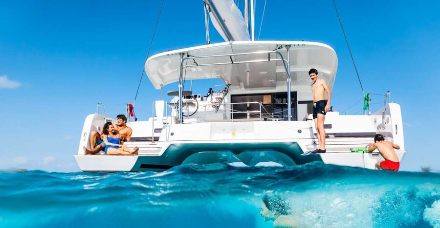 Mykonos: Catamaran Cruise with Lunch, Drinks and Transfer - Rhenia’s calm cove and two hours in the water
