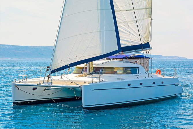 Mykonos Catamaran Delos Rhenia Cruise with Lunch and Transfer - Rhenia trades ruins for clear water and quiet coves