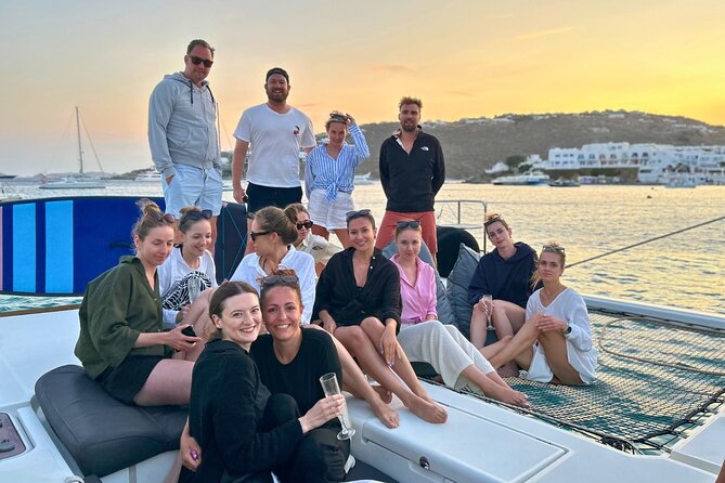 Mykonos Catamaran Sunset Cruise with Meal, Drinks & Transfer - Sailing past Psarou Beach