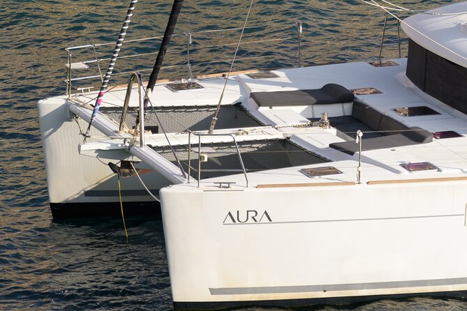 Mykonos Catamaran Sunset Cruise with Meal, Drinks & Transfer - Swimming, snorkeling, and water toys