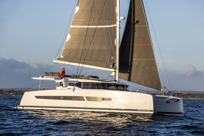 Mykonos: Luxury Catamaran Cruise with Meal, Drinks & Transport - Lunch, wine, beer, and the real value of the package