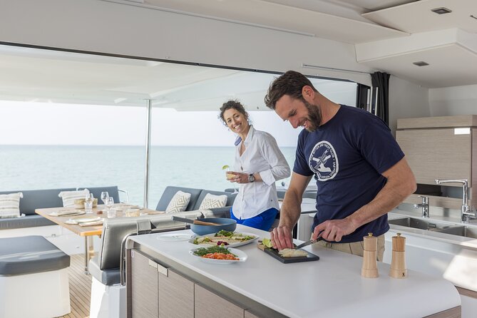 Mykonos: Luxury Catamaran Cruise with Meal, Drinks & Transport - What the catamaran layout means for your day