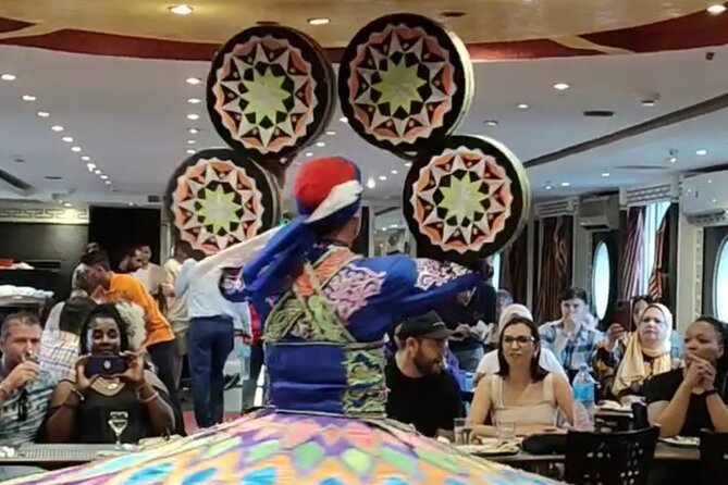 Nile Dinner Cruise in Cairo With Belly Dancing and Transfer - Belly dancing, Arabic music, and the Tanoura show
