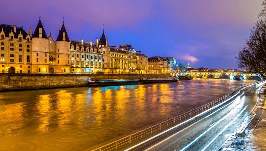 Paris: Bastille Day Dinner Cruise on the Seine River - A dinner table with Paris moving past the window