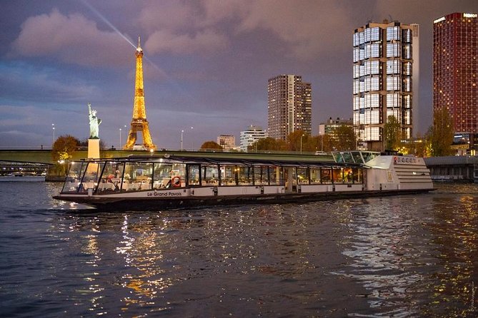 Paris Seine River Dinner Cruise with Champagne and Window Seating - The Conciergerie and Notre-Dame after dark