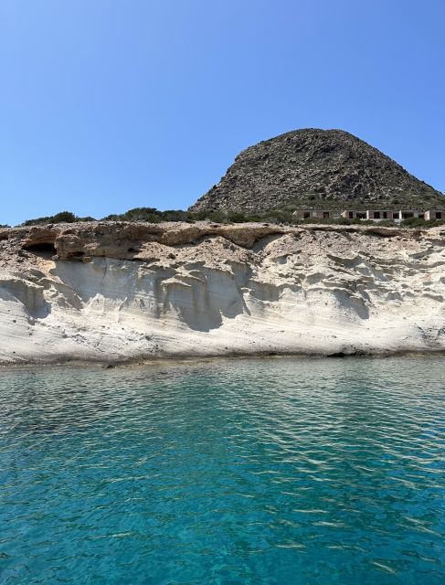 Paroikia: Despotiko & Blue Lagoon Cruise with Meal & Drinks - Caves and rocky shorelines