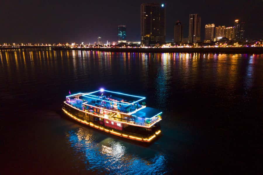 Phnom Penh: Sunset Dinner Cruise with English Speaking Guide - The Royal Palace and Hotel Cambodiana from the water