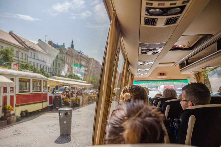 Prague: Guided Bus & Walking Tour with River Cruise & Lunch - Dancing House and Rudolfinum from the road