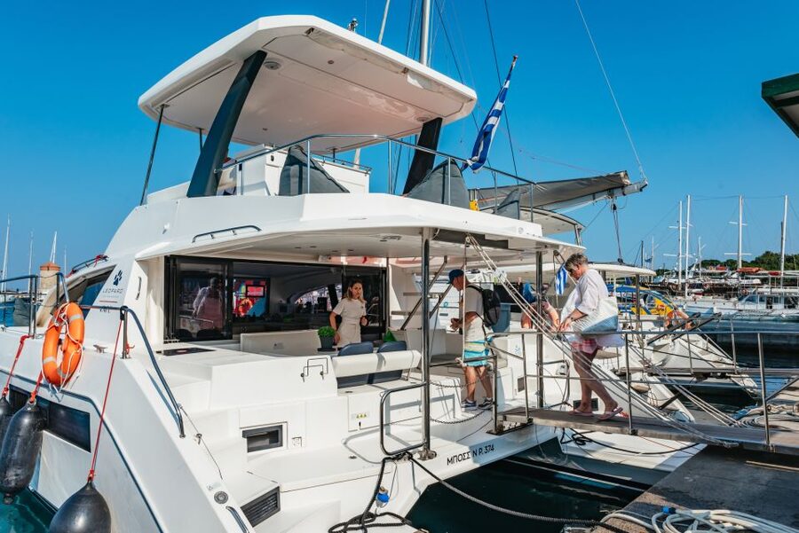 Rhodes: Sunset Catamaran Cruise with Dinner Buffet & Drinks - Leaving Mandraki Harbor for Kalithea Bay