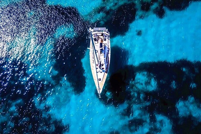 Sailsational Luxury Santorini Catamaran Sunset Cruise with Dinner - White Beach and Santorini’s pale volcanic rock