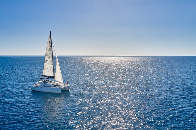 Santorini: Caldera Private Catamaran Cruise with Meal & Drinks - Greek lunch served aboard the catamaran