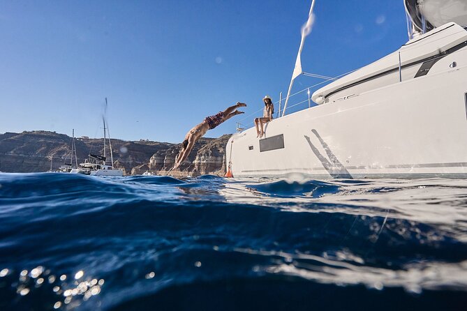 Santorini: Caldera Private Catamaran Cruise with Meal & Drinks - Daytime or sunset departure