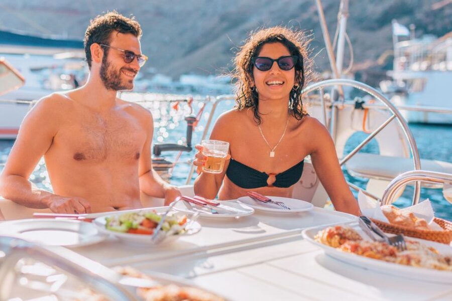 Santorini Caldera: Sunset Sailing Cruise with Meal - Akrotiri Lighthouse and the turn into the caldera