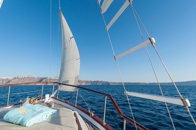Santorini Caldera Sunset Traditional Cruise with Meal and Drinks - Mesa Pigadia and the Akrotiri Lighthouse
