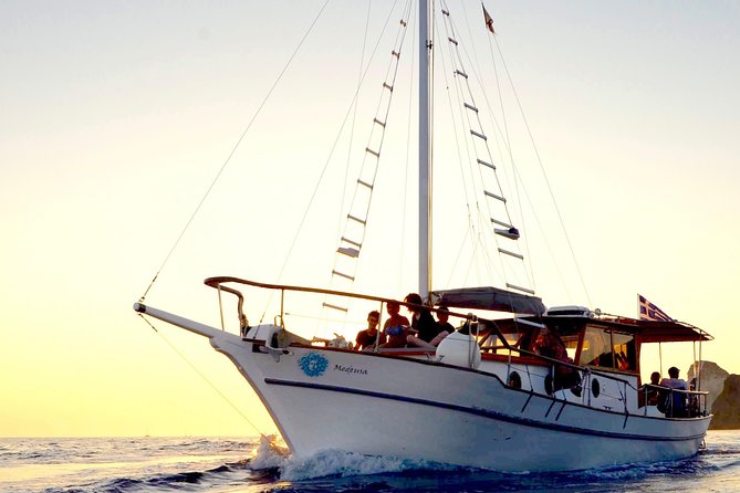 Santorini Caldera Sunset Traditional Cruise with Meal and Drinks - Red Beach Adds Santorini’s Famous Color