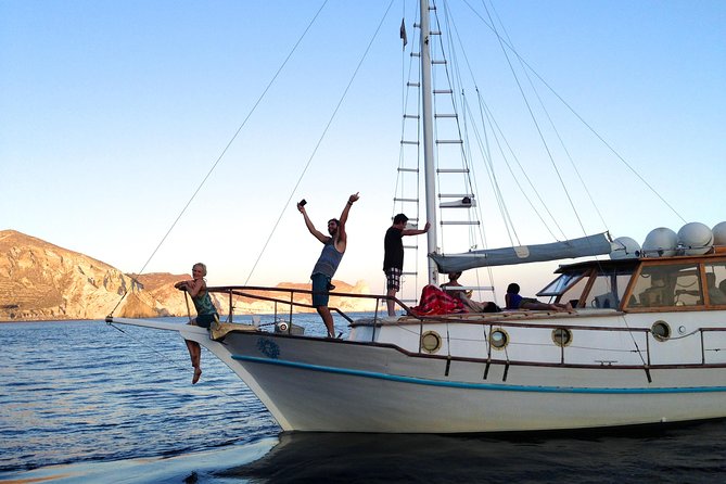Santorini Caldera Sunset Traditional Cruise with Meal and Drinks - Thirassia: Swimming Before Dinner