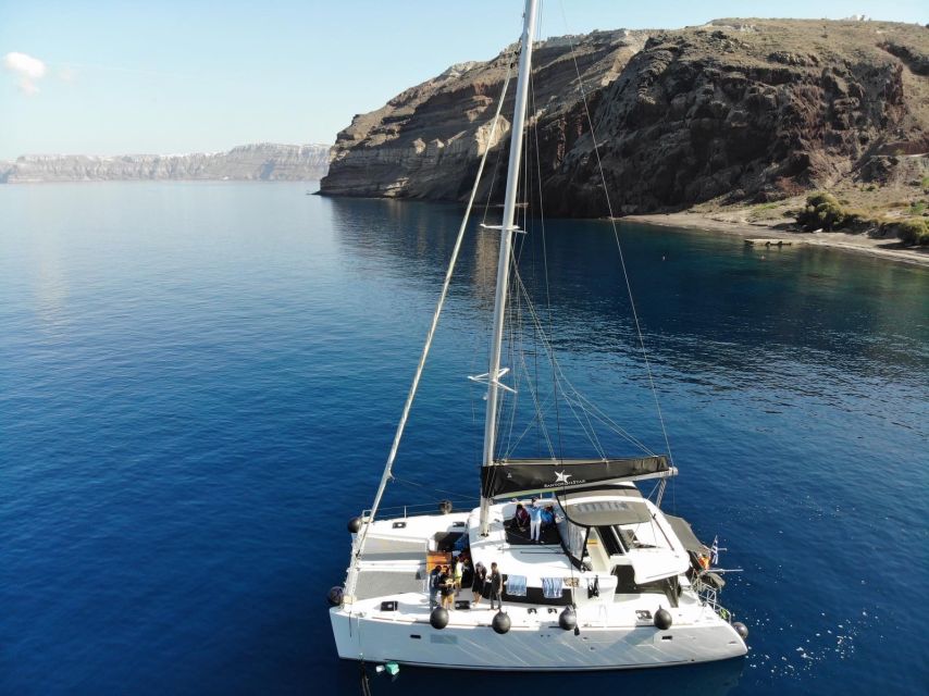 Santorini: Catamaran Cruise with Meal & Open Bar - Sunset, music, and the ride back