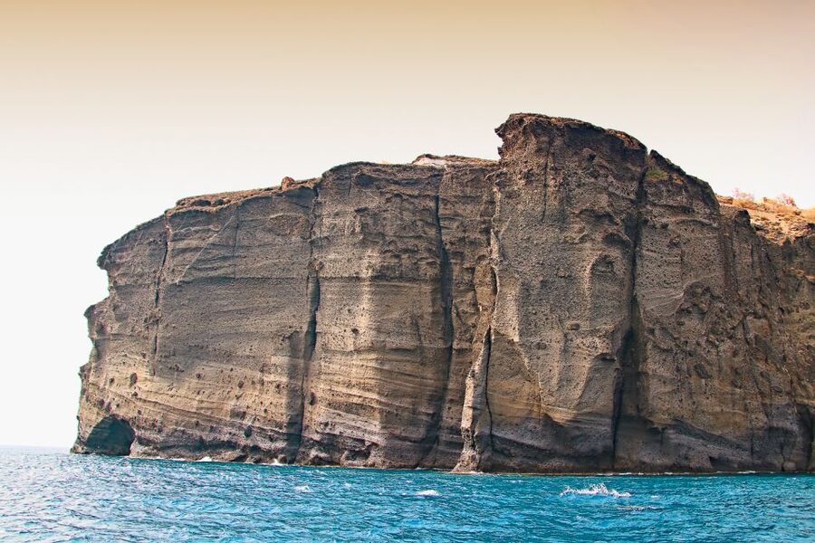 Santorini: Day Cruise with Meal & Open Bar - White Beach, Black Mountain, and the Lighthouse