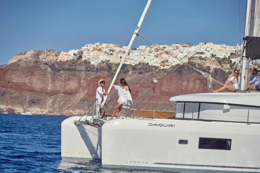 Santorini: Day Luxury Catamaran Cruise with Meal & Drinks - Thirassia Island Brings the First Swim