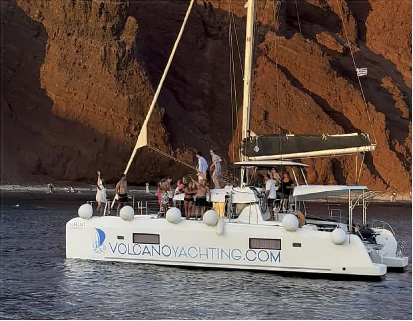 Santorini: Luxury Caldera Cruise With Meal & Drinks - White Beach, Black Mountain, and the lighthouse