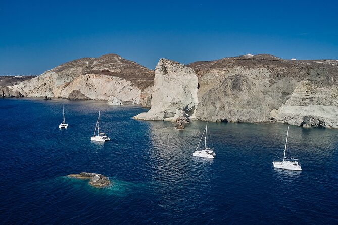 Santorini: Luxury Catamaran Cruise with Fresh Fish BBQ & Drinks - Leaving Imerovigli for the volcanic south coast