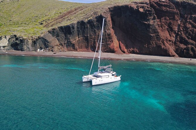 Santorini: Luxury Catamaran Cruise with Fresh Fish BBQ & Drinks - Fresh seabream, Greek salads, and drinks aboard