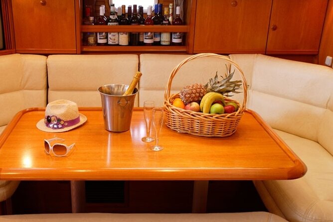 Santorini: Private Sailing Yacht Cruise with Meal and Drinks - The color shift toward White Beach