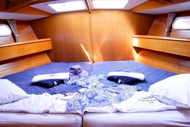 Santorini: Private Sailing Yacht Cruise with Meal and Drinks - The lighthouse and the southern tip